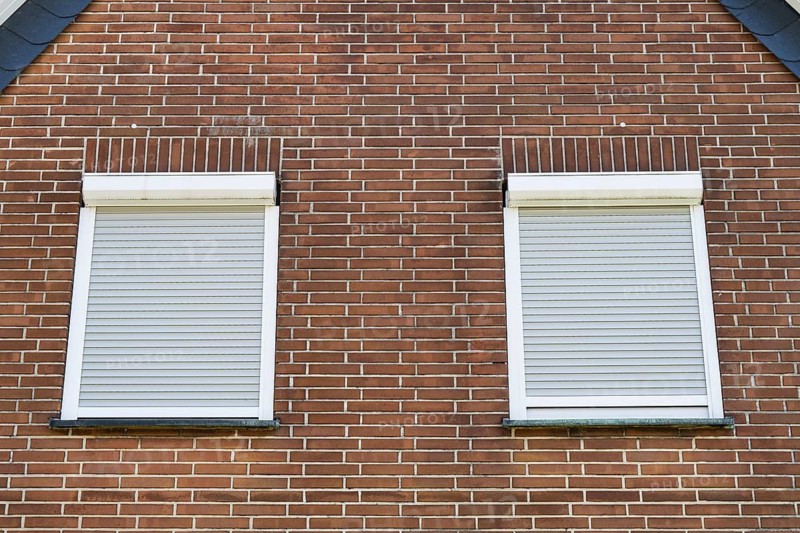 Window with closed shutters in a brick façade, detail, Westphalia, North Rhine-Westphalia, Germany