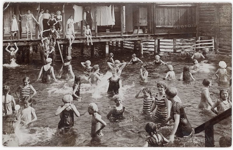 Nadeanstalt, bathing, swimwear, woman, men, children, leisure, fun, summer, group of people in striped bathing suits bathing in front of a wooden house, 1909