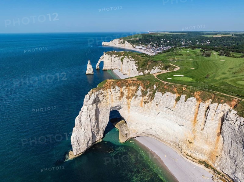 Aerial view of the rock gate La Manneporte rock gate behind the Porte d'Aval rock formation, well-known sights on the chalk coast with the distinctive rock pin, behind it the holiday resort of Étretat with the beach, on the horizon the Falaise d'Amont cliffs, right on the cliffs of the Golf d'Étretat golf course founded in 1908, Alabaster Coast, La Côte d'Albâtre, chalk cliffs, English Channel, Seine e-Maritime, Normandie, France