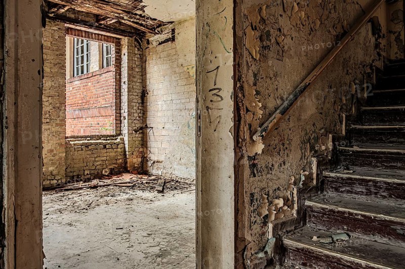 Empty dilapidated room and climb to the attic, former pulmonary hospital and lost place Heilstätte Grabowsee, Oranienburg, Brandenburg, Germany