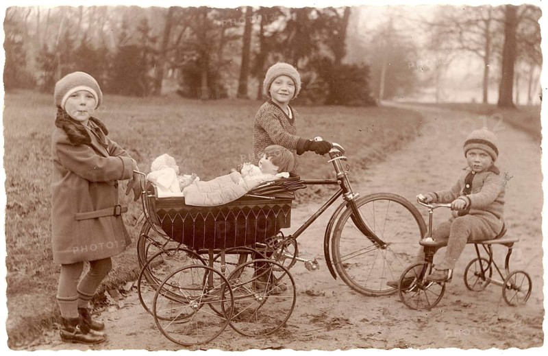Girls in the park, tricycle, doll pram, twenties, children with bicycle and stroller in the park, a foggy autumn morning, around 1924