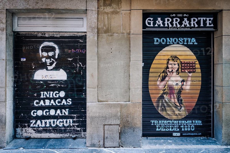 Typical Spanish art graffiti at a shop in the old town of San Sebastian, Spain