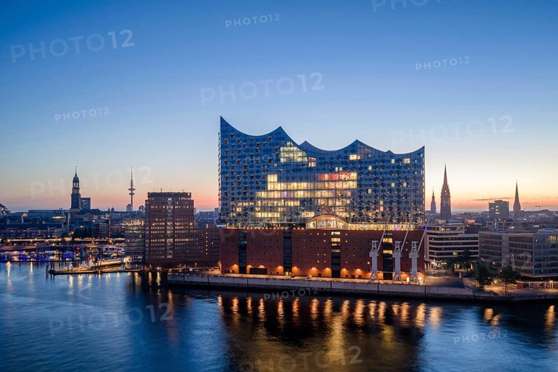 Aerial view of the sunrise on the Elbe with Elbe Philharmonic Hall, St Michael's Church (Michel) and Heinrich Herz Tower, Hamburg, Germany