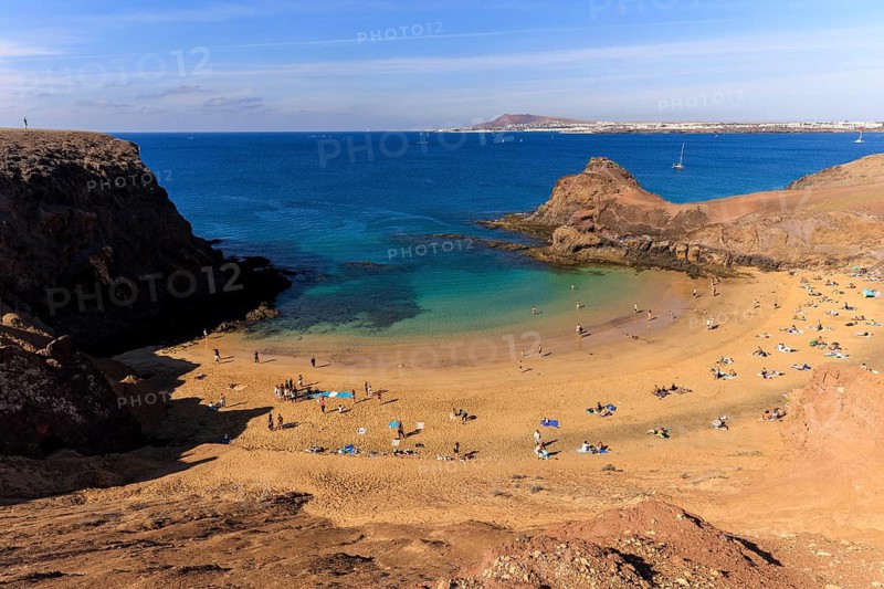 Lanzarote, Canary Islands, Spain, Europe, Playas de las Papagayo, A relaxing beach day with blue waters and cliffs under a clear sky