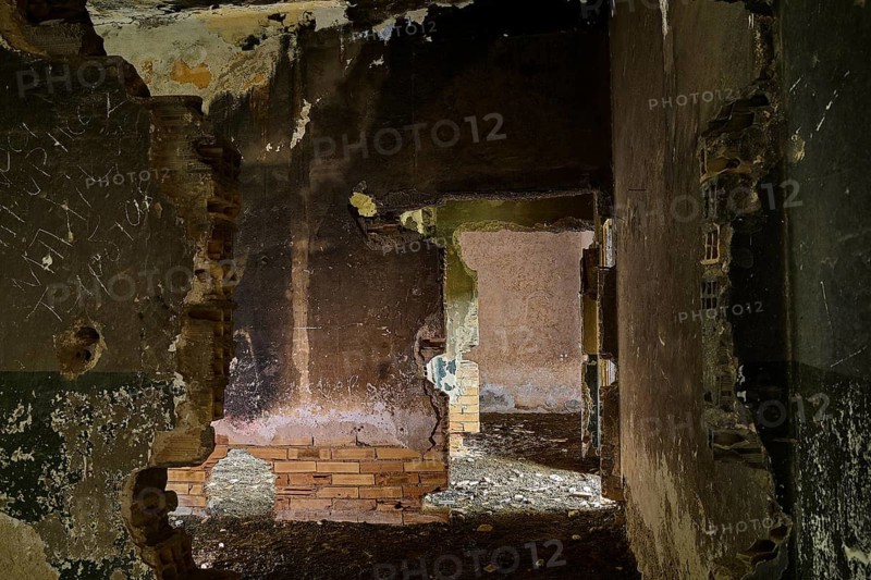 Abandoned ruin with broken walls and a dark, partially collapsed passage, Lost Place, Tourtouras Mountain, WW2, World War II, German coastal battery PL 388, marine artillerymen, Diapori, Xirokambos, Leros, Dodecanese, Greek Islands, Greece