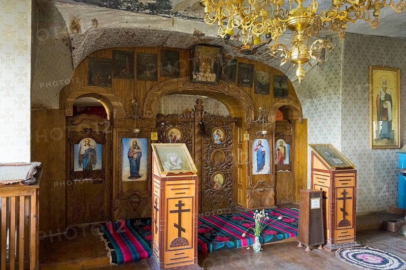 Orthodox altar with icons and a golden chandelier in a decorated chapel, cave church, rock caves, cave dwellings, ?ipova monastery, Uspenski monastery, Tipova, Rezina region, Republic of Moldova, Moldova
