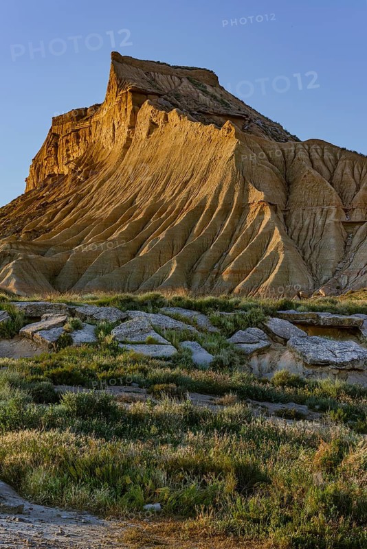 Bizarre rock formation in evening light in Bardenas Reales nature park Park, Navarra, Spain