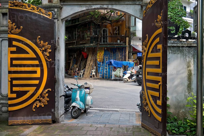 A view from a historic temple courtyard of handcrafted bamboo ladders, metre-long bamboo poles, bamboo tubes and traditional water pipes on Hàng V?i Street (Bamboo Street), in the Old Quarter of Hanoi, Vietnam