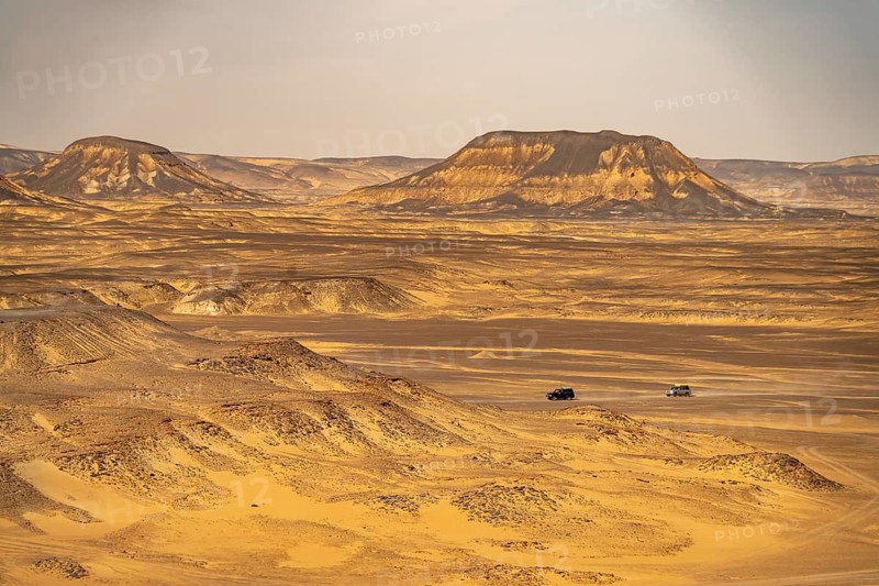 Off-road vehicle with tourists in the Black Desert in the Egyptian part of the Libyan Desert, Egypt