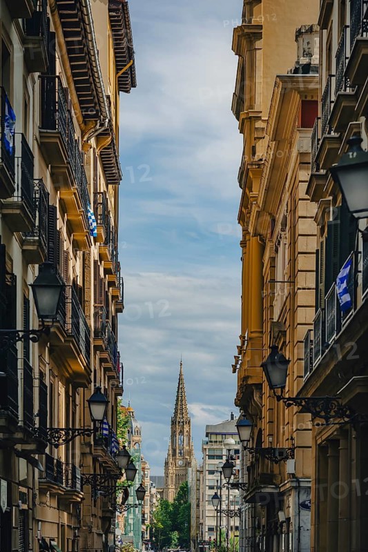 A street in the old town with a view of the Cathedral of the Good Shepherd (Catedral del Buen Pastor), San Sebastián, Basque Country, Spain