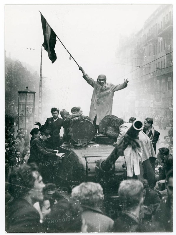 Badapest, uprising October 23, 1956, Soviet tank, taken possession, eventful street scene with people on a tank of a protest movement