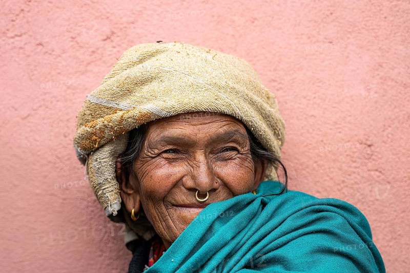 Portrait, friendly smiling elderly woman with traditional jewelry, Hindu ethnic group, Himalayas, Simikot, Humla region, western Nepal, Nepal