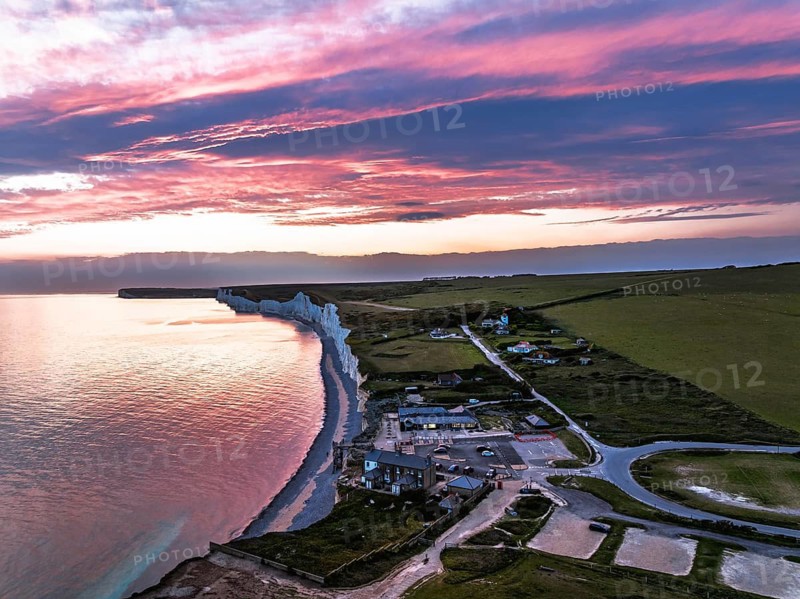 Sunset over Seven Sisters Cliffs from a drone, English Channel, East Sussex, South-east England