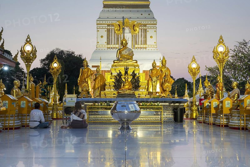 Chedi decorated with golden ornaments at Wat Phra That Phanom at sunset, temple complex in Amphoe That Phanom, Nakhon Phanom Province, Isan, Thailand