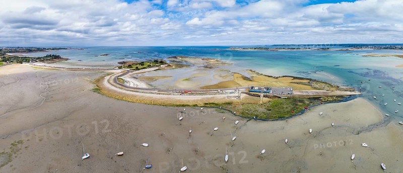 Aerial view, panorama of the peninsula, Îlot Sainte-Anne and the surrounding Wadden Sea landscape on the Breton coast with shallow sandbanks in turquoise seawater, Saint-Pol-de-Léon, Finistère, Brittany, France