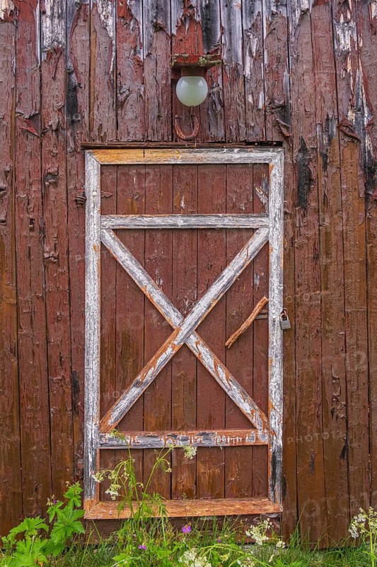 View of a door of a barn on a farm in the mountains of Gol in the rain, Halligdal, Buskerud, Norway