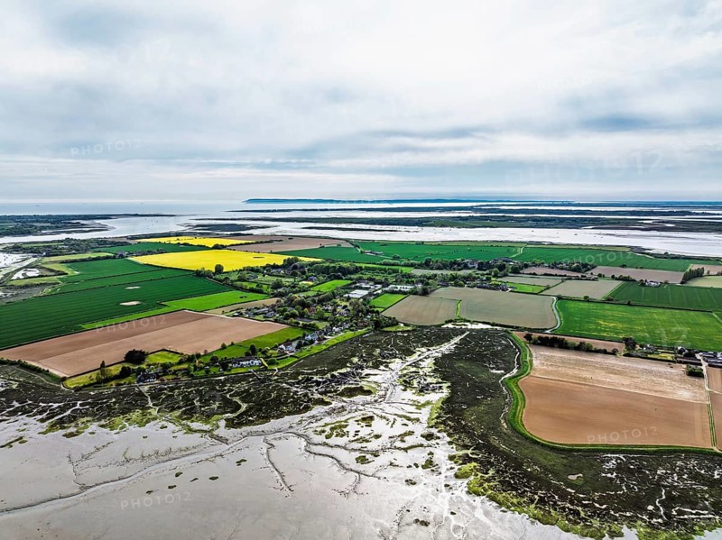 Fields and Farms over Bosham Quay from a drone, Chichester Harbour National Landscape, Chichester, West Sussex, England, United Kingdom