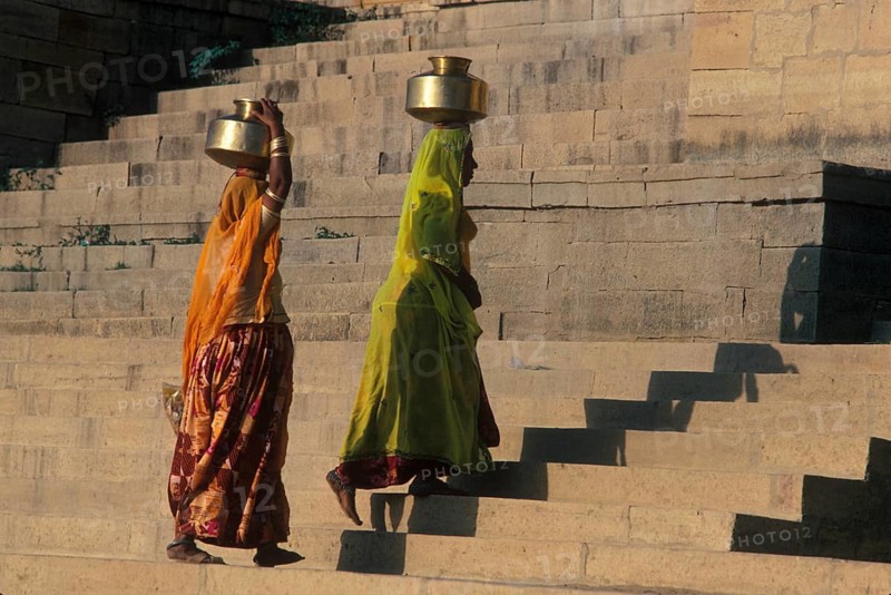Women carry stuffed water balls on their heads at Gadsisar Lake, Jaisalmer, Rajastan, India