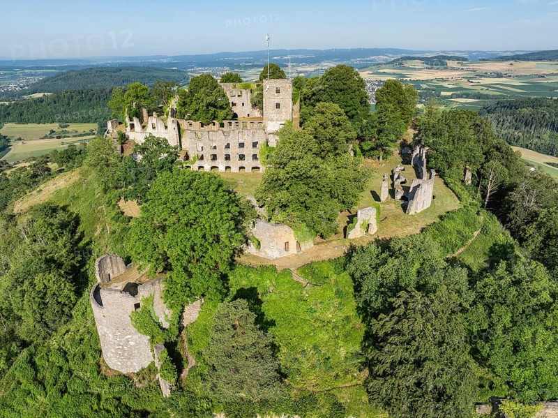 Aerial view of the Hohentwiel volcanic cone with Germany's largest fortress ruin, in the morning sun, a tourist attraction in the Lake Constance region, Hegau, Konstanz district, Baden-Württemberg, Germany