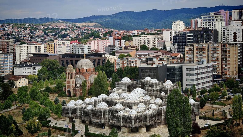 National Library, Pjeter Bogdani, view of modern architecture with characteristic domes and surrounding residential buildings, Pristina, Kosovo