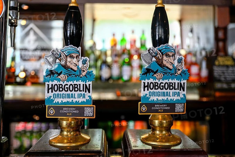 Hobgoblin Original IPA Ale taps at the bar counter, London, England, Great Britain