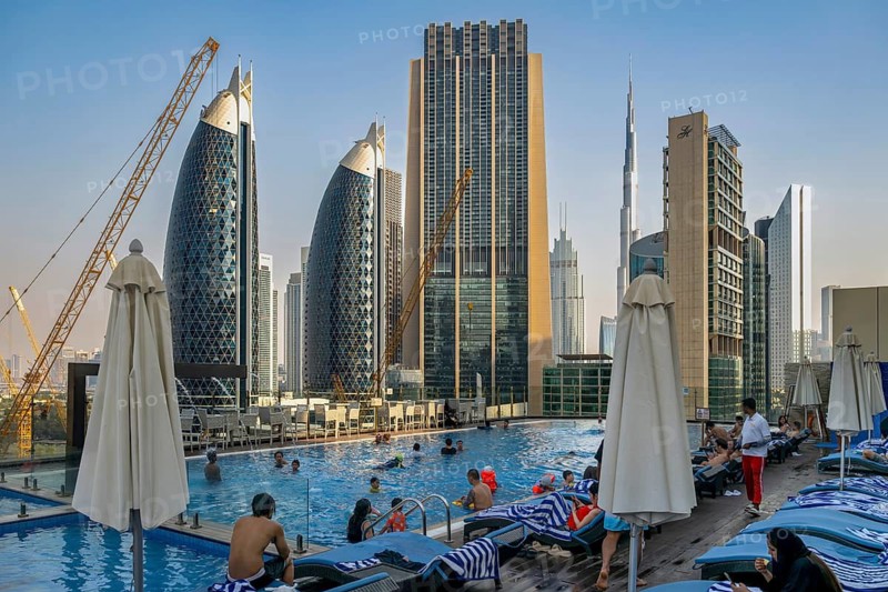 Swimming pool with view of Park Towers, The Index, Burj Khalifa and Liberty House, Dubai, United Arab Emirates, UAE