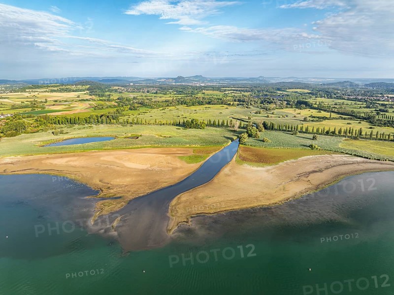 Aerial view of the Radolfzell Aachen estuary at historic lows, low tide at water level 286 cm with flow lines, structures, patterns, sediments. As a result of the deposits of entrained suspended matter and sediments from the inflow, the shore zone between Radolfzell am Lake Constance and moss, on the horizon the Radolfzell Aachried and the Hegauberge Mountains, Untersee, Konstanz district, Baden-Württemberg, Germany