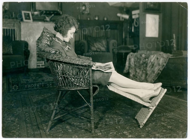 Lilian Harvey, 1906-1968, actress, singer, dancer, film, own apartment, reading a newspaper, woman relaxing in a chair in a traditional living room and reading a book. cozy atmosphere, photographer, Siegmund Frank, 1872-1933, Jewish