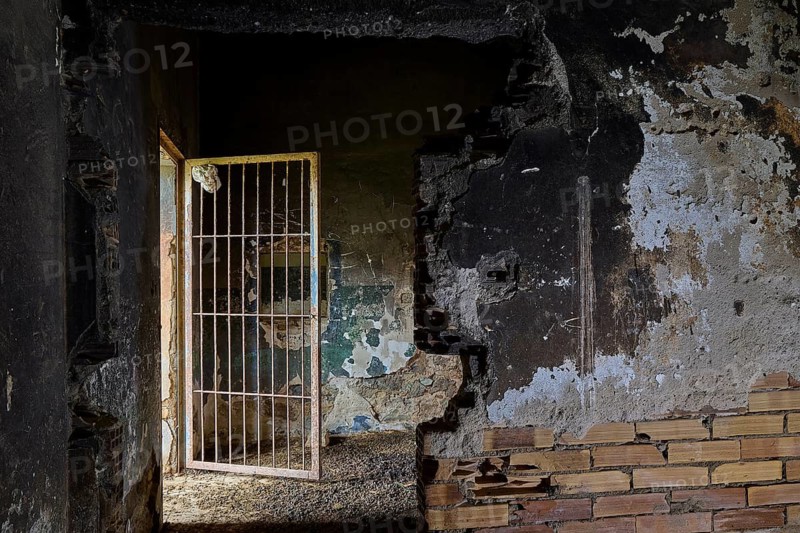 Gloomy scene in an old building with destroyed walls and a partially opened door, Lost Place, Tourtouras Mountain, WW2, World War II, German Coast Battery PL 388, Marine Artillerists, Diapori, Xirokambos, Leros, Dodecanese, Greek Islands, Greece