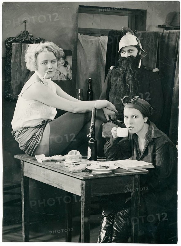 Else Elster, film, German, silent film, studio scene with two woman and a man in costumes sitting at a table