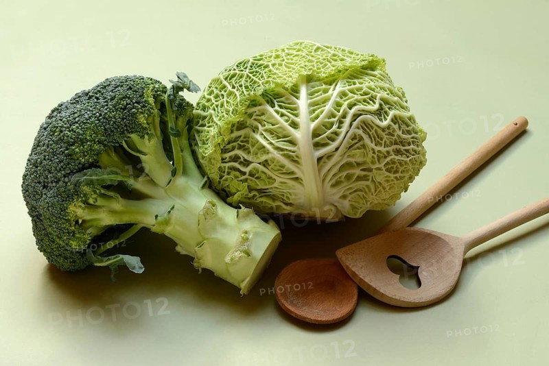 Savoy cabbage and broccoli with cooking spoon