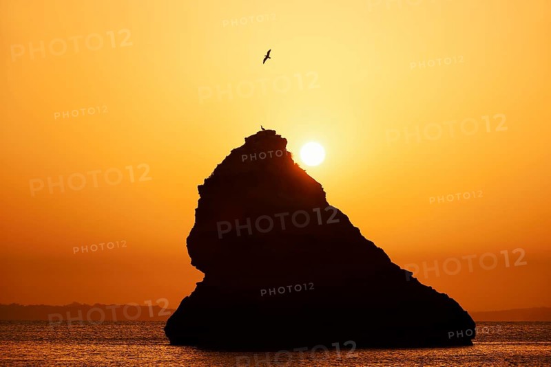 Rocks in the sea at sunrise, Praia Dona Ana, Lagos, Algarve, Portugal