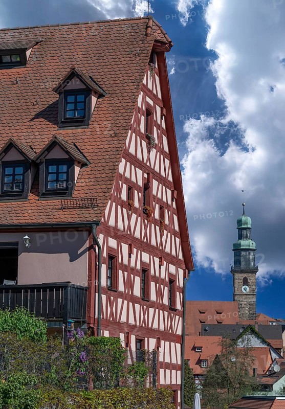 Historic Franconian half-timbered house, St. John's Church in the back, Lauf an der Pegnitz, Middle Franconia, Bavaria, Germany