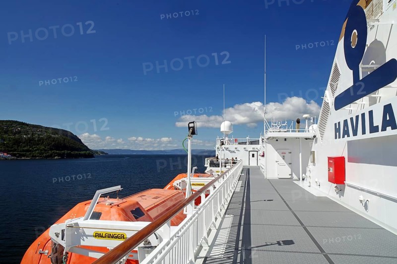 A modern ship deck with lifeboats under a clear blue sky, Havilla, mail ships, Trondheim, Norway