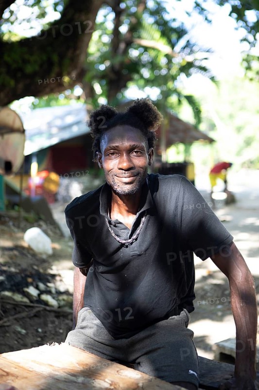 Jamaican man with Mickey Mouse hairstyle on Winnifred Beach or beach, Portland Parish, Jamaica, West Indies, Caribbean, Central America