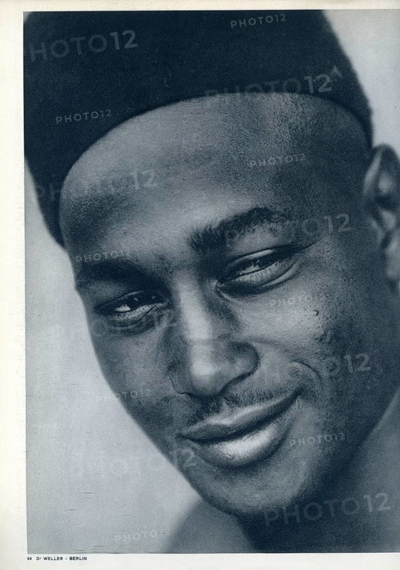 Arab, African, portrait, close-up of a man in a thoughtful expression wearing a cap, Dr. Peter Weller, 1931
