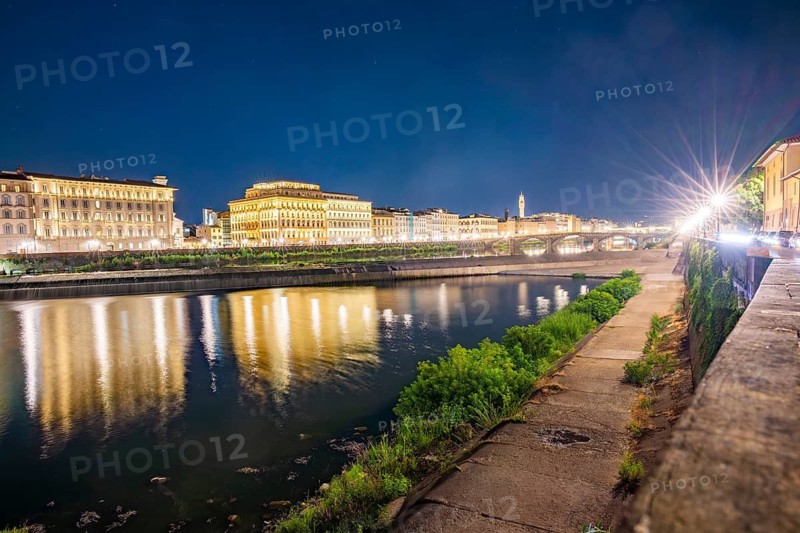 Promenade with arno river in front at blue hour, Florence, UNESCO World Heritage Site, Tuscany, Italy