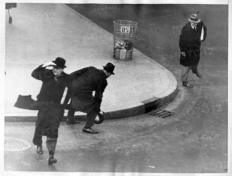 New York, Financial District, Storm, Where is My Hat, Snapshot, Three men in cloaks and hats hurrying through a street corner in foggy weather, a classic cityscape