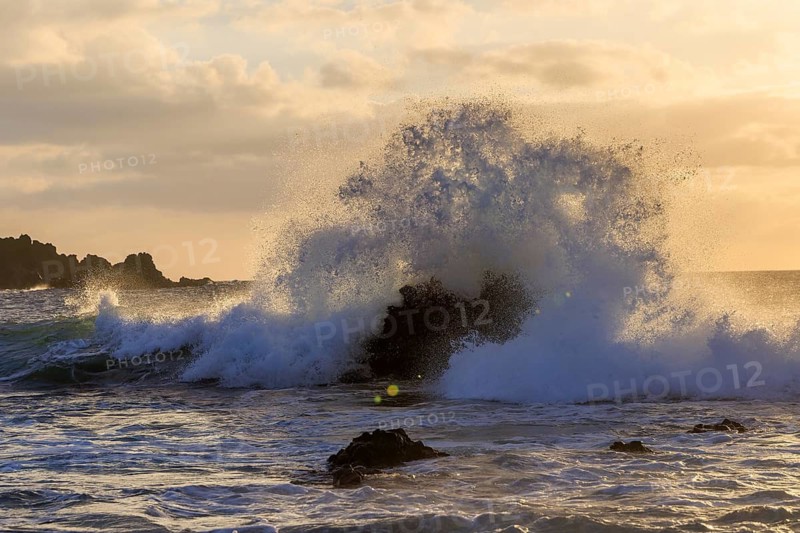 Lanzarote, Canary Islands, Spain, Europe, Los Hervideros, Dramatic waves hit rocky shores at sunset