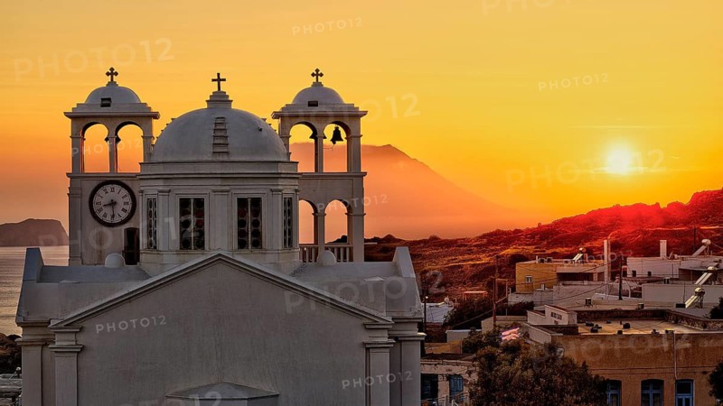 Church, orthodox, Greek Orthodox church, Agios Nikolaos church, a church appears against an orange sunset with sea view and mountains, Trypiti, Tripiti, village, Milos, island, Cyclades, Greek islands, Greece