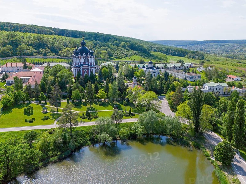 Landscape with a cathedral on the shore of a lake surrounded by well-kept gardens and hills, aerial view, Cathedral of the Nativity of the Virgin Mary, Curchi monastery, Orhei district, Republic of Moldova, Moldova