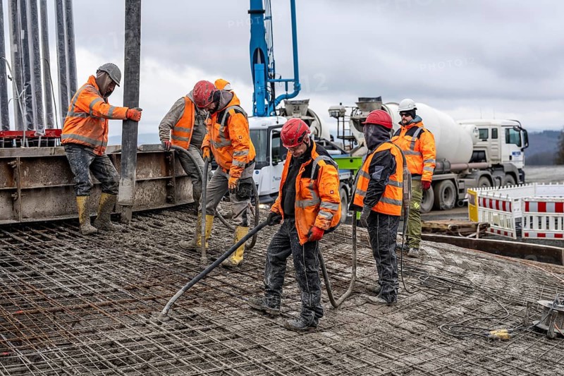 Concreting, concreting the foundation of a wind turbine, more than 600 cubic meters of concrete will be pumped into the foundation for over 7 hours, over 100 tons of reinforcing steel have been used, the wind turbine will have a hub height of 160 meters, part of a new wind farm in Sauerland, near Balve, North Rhine-Westphalia, Germany
