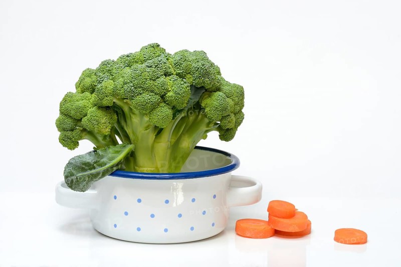 Broccoli in pots and carrot slices, Brassica oleracea var. italica