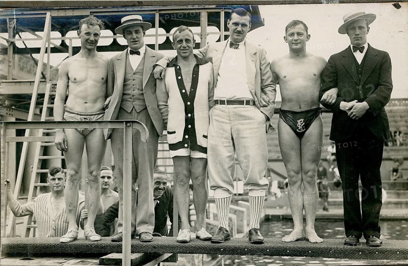 German Stadium, Schwimmstadion, Berlin Grunewald, German University of Physical Exercises, group of men in various swimwear and suits standing on a diving board at the swimming pool, Gerhard Riebicke, around 1930