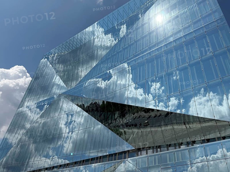 The 'cube Berlin' is a spectacular, cube-shaped office building on Washingtonplatz, right next to Berlin Central Station. It was completed in February 2020 and is considered one of the most innovative and smart buildings in Europe. The glass façade reflects the surroundings in a kaleidoscopic and cubist way. architecture, cubism, cube, reflection, innovation, landmark. Designed by renowned Danish architecture firm 3XN Architects. Washingtonplatz 3, 10557 Berlin, Mitte district, directly at the main train station, Germany