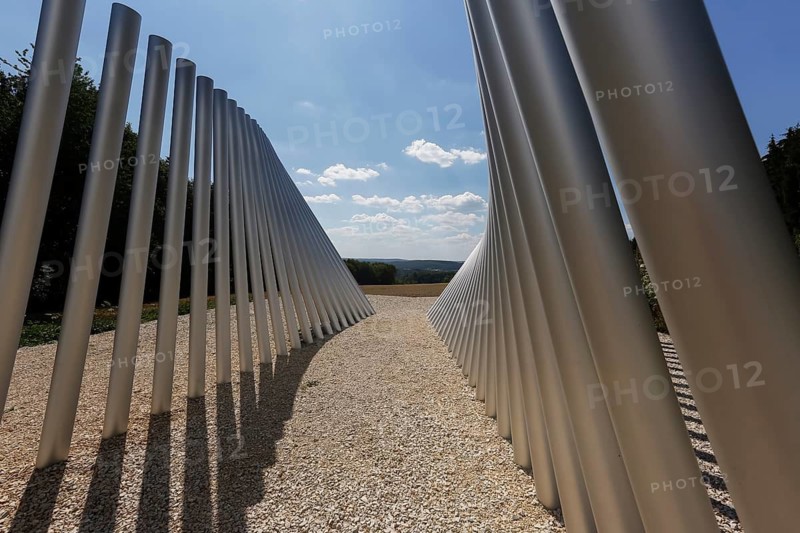 Art in public space, sculpture made of aluminum profile pipes by artist Martin Burchard, life's horizon path near Mundingen, light and shadow, gravel, clouds, blue sky, walk-in art, paths of reflection and refreshment on the Ehinger Alb, Baden-Württemberg, Germany