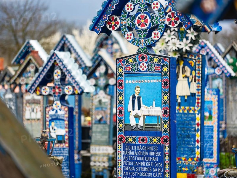 Colourfully painted wooden crosses in the cheerful Cimitirul Vesel cemetery, Sapân?a, Maramure?, Romania