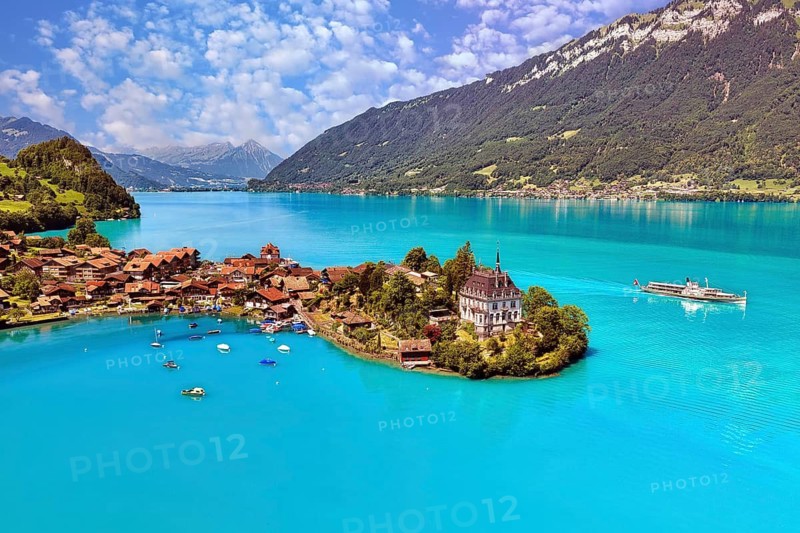 View of Iseltwald from above, peninsula in Lake Brienz with steamboat, Canton of Bern, Switzerland