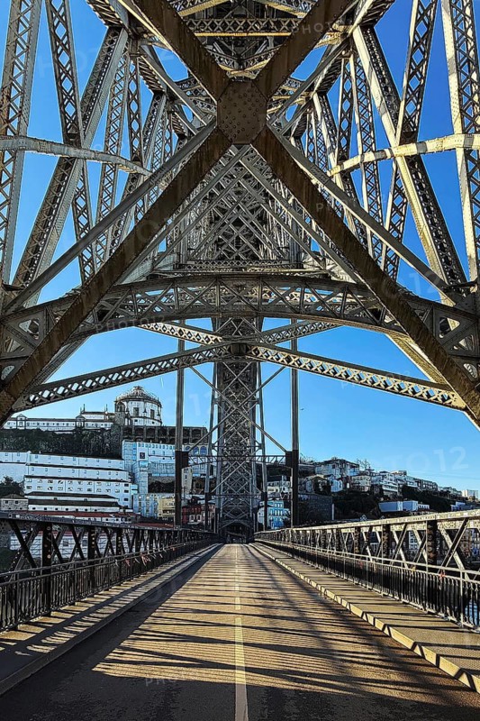 Ponte Dom Luis I arched bridge designed by Théophile Seyrig, looking up from the lower level towards Vila Nova de Gaia, Porto, Portugal