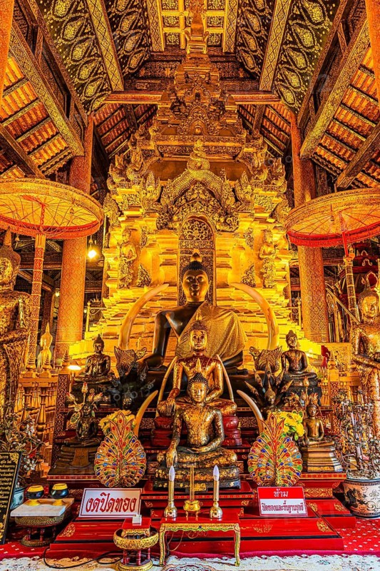 Sumptuous interior with richly decorated wooden ornaments, gilded Buddha statues, Buddhist temple complex Wat Phra That Si Chom Thong, near Chiang Mai, Chiang Mai Province, Thailand